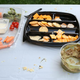 Illustration for article titled Late-Arriving Guest Encouraged To Load Up On Food Sitting In Sun For Past 4 Hours